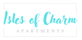 A sign that says "Isles of Charm Apartments" in a cursive font.